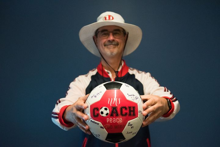 Photo of Graham Peace with UHS soccer ball