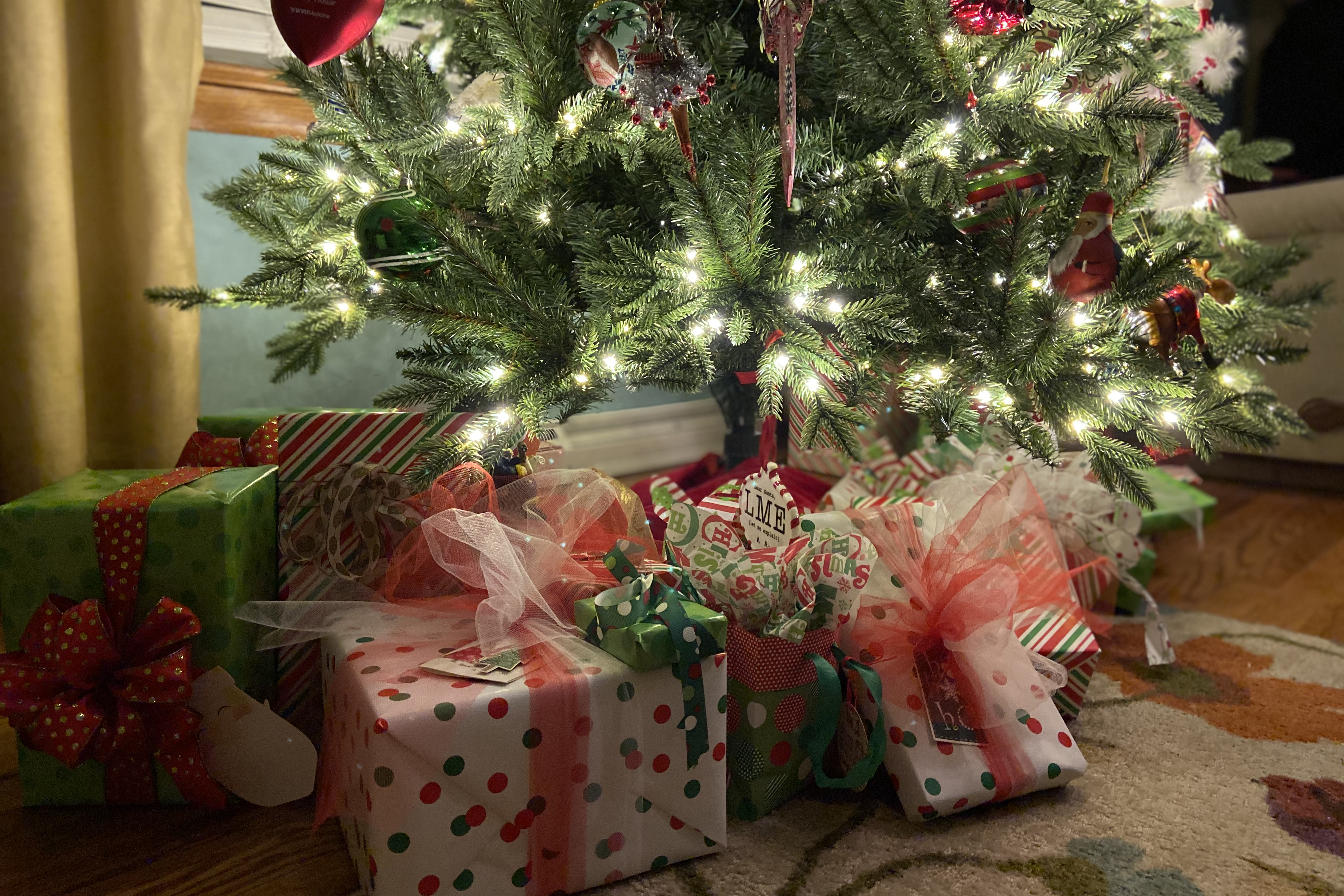 Photo of Christmas tree with presents underneath